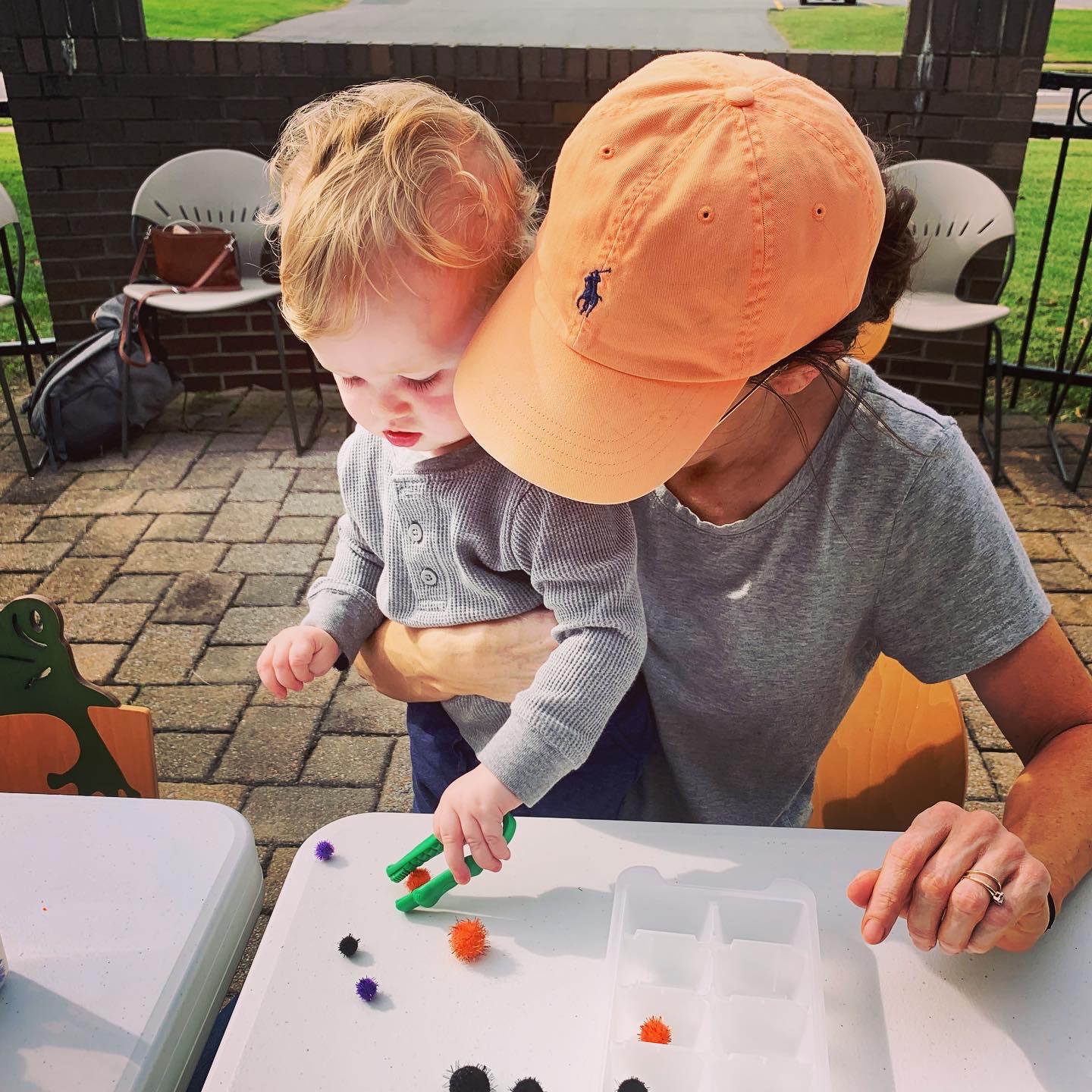 child counting pom poms