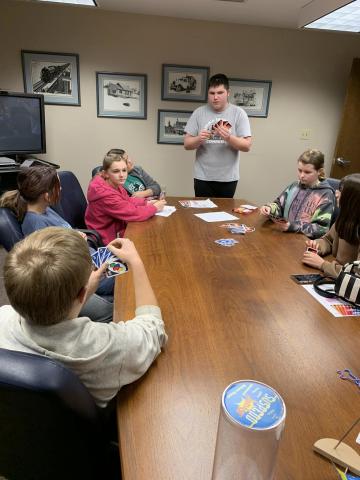 older youth playing card game